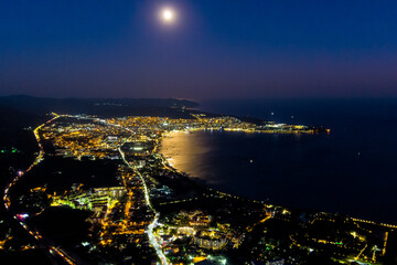 Gelendzhik, Russia. View of the night city, bay and moon. Summer. Aerial view