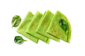 Fresh prepared delicious green spinach crepes isolated on white background, top view