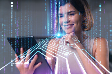 Smiling businesswoman in casual wear holding tablet device touching it at office workplace. Concept of distant work, business education, information technology. Ai hologram