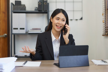Work of secretary concept, Female secretary talks on phone to explaining business data to executive