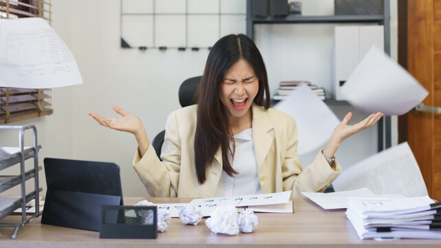 Work of secretary concept, Female secretary screaming and throwing paper while stressed mistake job