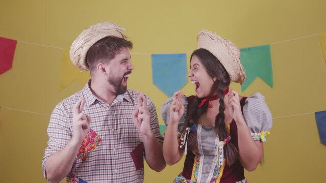 Brazilian couple, dressed in Junina party clothes, S&atilde;o Jo&atilde;o party. Protocol scenes.