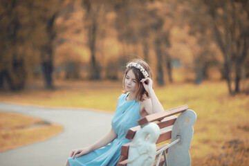 Young girl on a walk in the autumn