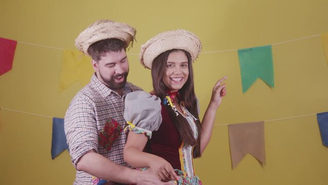 Brazilian couple, dressed in Junina party clothes, S&atilde;o Jo&atilde;o party. Protocol scenes.