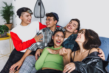 Young latin LGBT friends portrait celebrating gay pride month at home in Mexico, Hispanic homosexual people from lgbtq community in Latin America