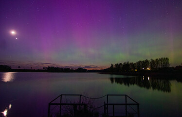northern lights and its reflection the lake, northern lights shimmer over the lake, northern lights in spring, Lielais Ansis, Rubene, Latvia
