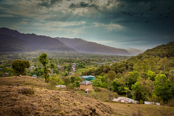 Mountain landscape with green grass, meadows scenic camping Himalayas peaks region of bir Himachal Pradesh, India.
