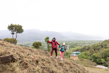 Fototapeta premium Happy couple trekking on a mountain.