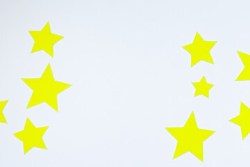 Yellow felt stars of different sizes on a white background. isolate