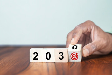 2030 goals of business or life. Team building. Wooden cubes with 2030 and goal icon. Starting to new year. Business common goals for planning new project, annual plan, business target achievement - obrazy, fototapety, plakaty