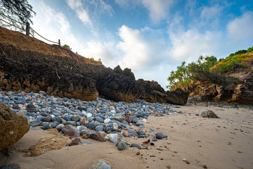 The island where the lighthouse is located There is an unusual rock formation with colorful round stones of various sizes filling the beach below. .Lanta lighthouse is popular landmark of Krabi.