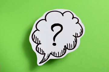 Question mark popup business concept on green background.