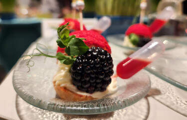 A beautifully decorated piece of blueberry cake