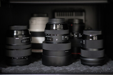 Camera lenses row equipment photo caputre cabinet photographer