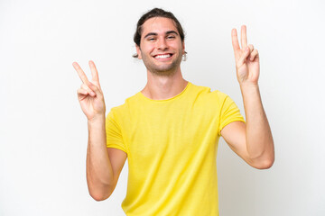 Naklejka premium Caucasian handsome man isolated on white background showing victory sign with both hands