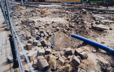 Big construction site with pipes and wires in the construction area. 