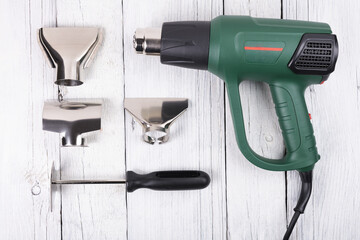 Construction hair dryer with different nozzles for work.