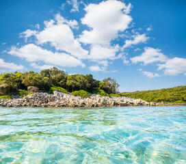 Fantastic wild tropical beach with turquoise sea on a sunny day. Cres island, Croatia, Europe.