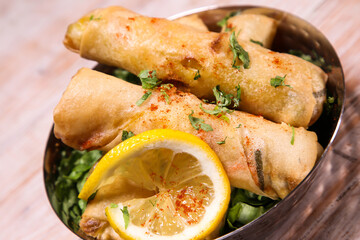 Deep Fried Vegetable spring roll with lime served in dish isolated on background top view of hot mezza