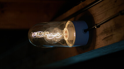 a light bulb in a dark hut