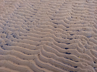 Beach sand ripples on the beach background. 