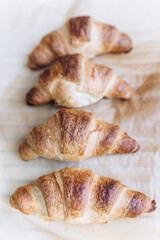 Freshly baked croissants with small flowers 