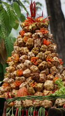 Ketupat is a typical Indonesian dish made of rice, wrapped in coconut leaves and boiled in hot water and usually eaten on idul fitri