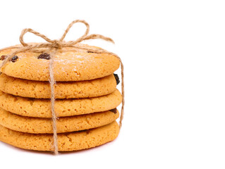 Round cookies with raisins on white background