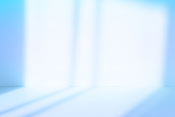 Abstract blue studio background with shadows of window. Empty 3d room. Display product with blurred backdrop.