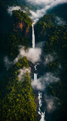 Aerial view of tropical rainforest with a giant waterfall. Clouds of fog over a wild river in the jungle. Generative AI