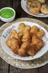Youtiao or baby cakoi fried breadstick with pandan green sauce
