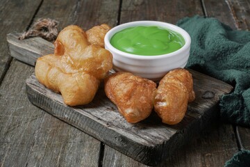 Youtiao or baby cakoi fried breadstick with pandan green sauce