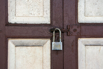Closeup old rusty lock on the wood door