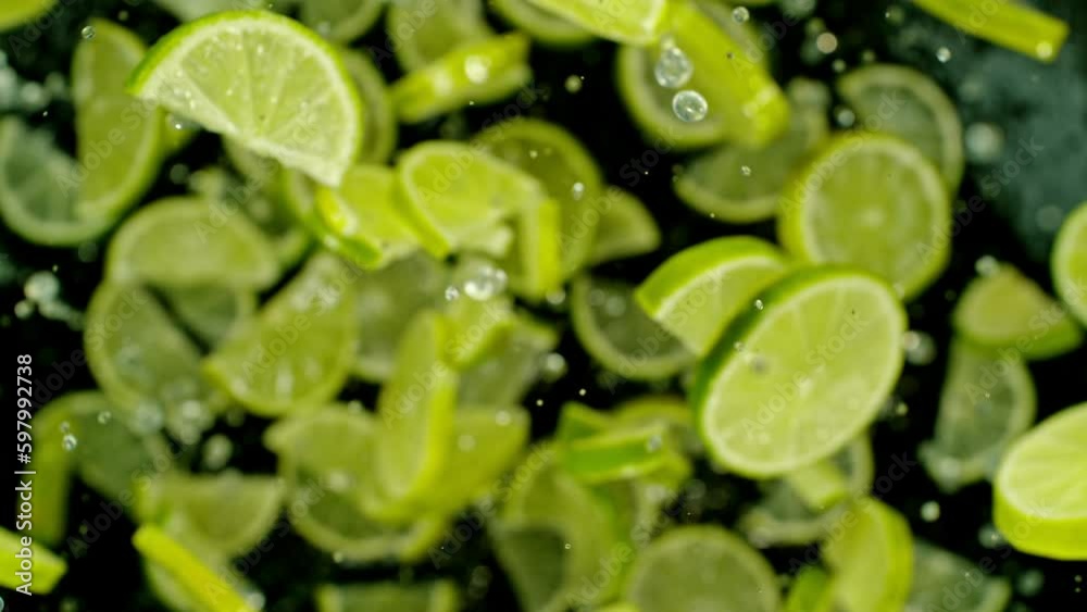 Aufkleber super slow motion of flying lime slices on black background. filmed on high speed cinema camera, 100