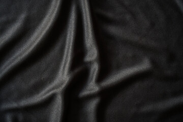 background of black shiny cloth texture can be use as background