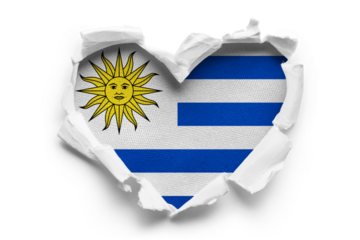 Heart shaped hole torn through paper, showing satin texture of flag of Uruguay, cut out
