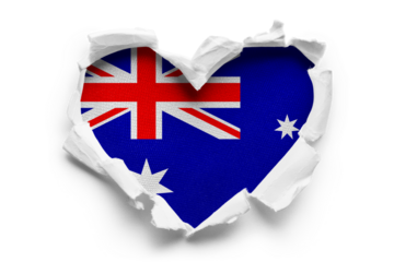 Heart shaped hole torn through paper, showing satin texture of flag of Australia, cut out