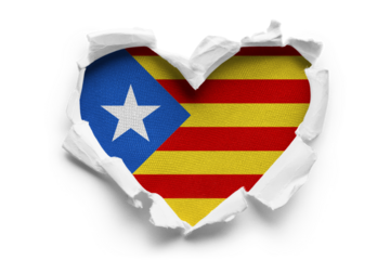 Heart shaped hole torn through paper, showing satin texture of flag of Catalonia, cut out