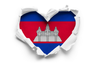 Heart shaped hole torn through paper, showing satin texture of flag of Cambodia, cut out