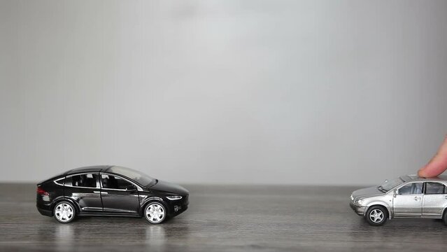 The concept of a traffic accident. Two car accident. Mini copy of the car.