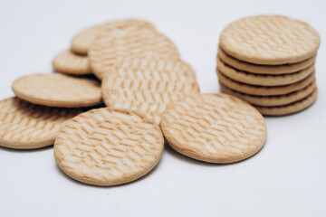 Cracker cookies lie on the table in a stack