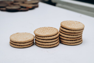 Cracker cookies lie on the table in a stack