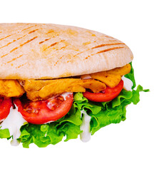 Doner kebab - fried chicken meat with vegetables in pita bread