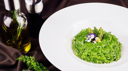 Dish of risotto with asparagus closeup