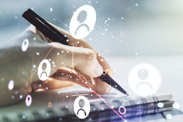 Social network concept with woman hand writing in notebook on background. Multiexposure