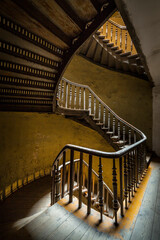 Old stairs in a tenement house. - 598007377