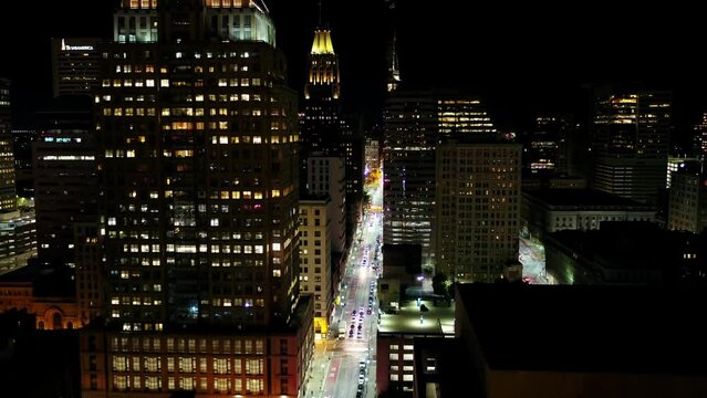 Aerial Slow Motion Shot Of Illuminated Buildings And Street In City At Night - Baltimore, Maryland