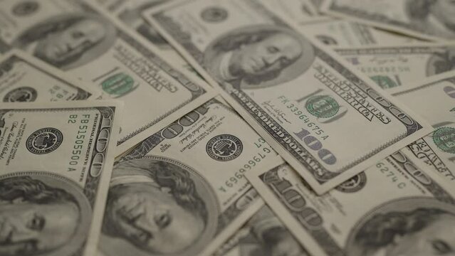 Closeup background of US Currency in 100 dollar banknotes