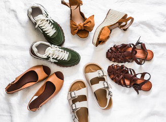 A set of women's summer spring shoes - sneakers, platform sandals, flat leather sandals, roman...