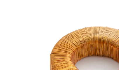 Electric transformer copper coil inductor on white background, close-up